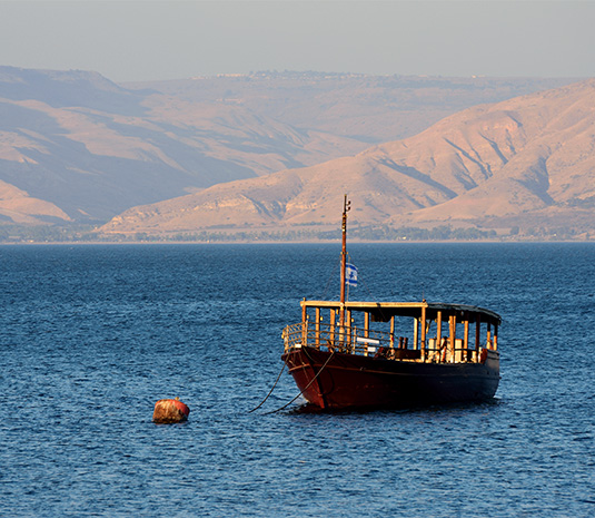 A fishing boat similar to the one used in the time of Jesus on the Sea of Galilee with Daniel Rona.