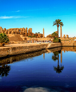The Great Hypostyle Hall of the Karnak Temple on the banks of the Nile River in the city of Luxor, Egypt with Daniel Rona.