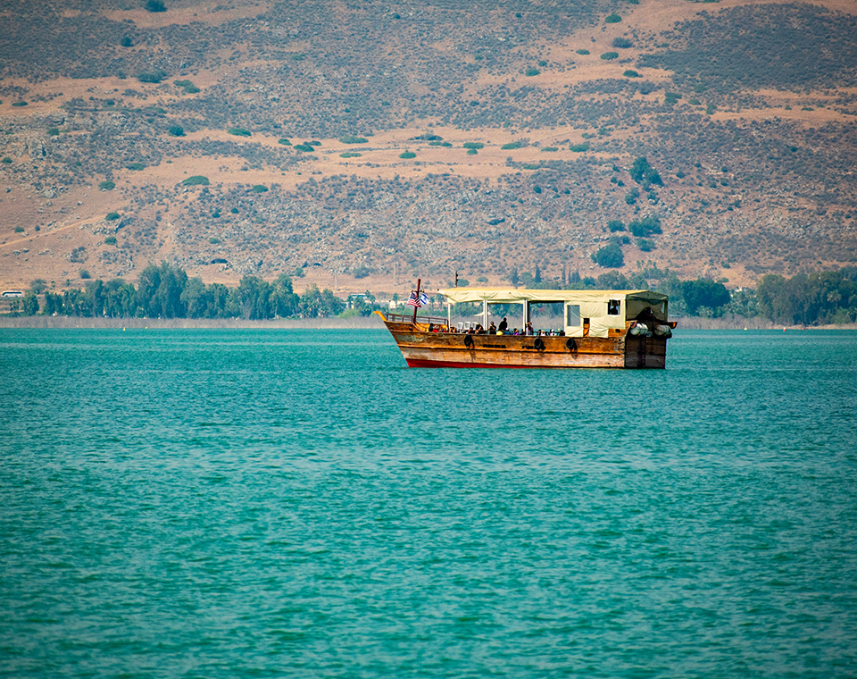 A traditional wooden boat on the Sea of Galilee with Steven Rona.