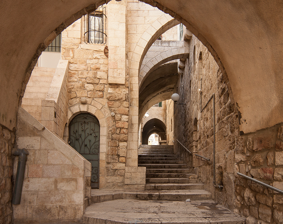 A narrow and ancient street in the Old City of Jerusalem, with Israel Revealed.