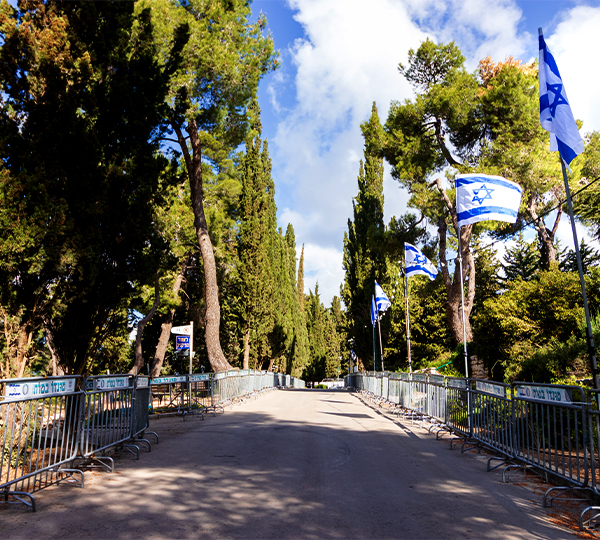 Israel flags along the path to Mount Herzl Cemetery with Daniel Rona, the only LDS licensed guide in Israel.